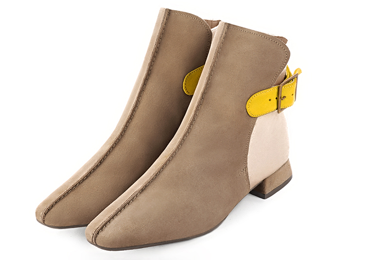 Tan beige, gold and yellow women's ankle boots with buckles at the back. Square toe. Flat flare heels. Front view - Florence KOOIJMAN